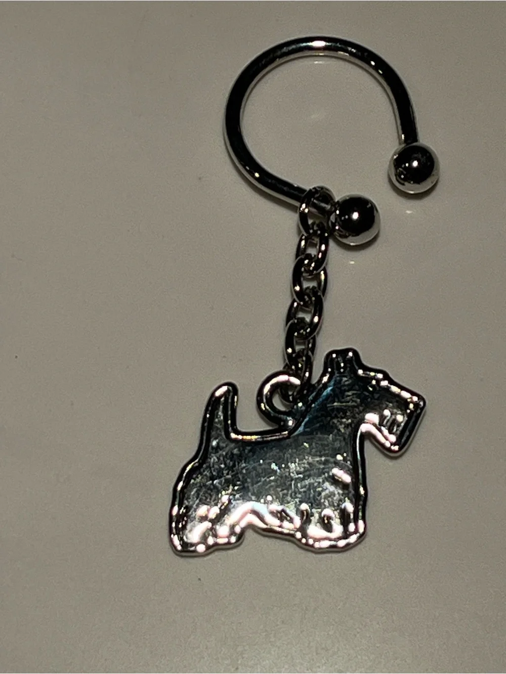 Great silver tone Scottish terrier dog keychain.  Approx 2.5” long.